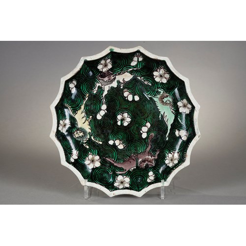 Dish biscuit Famille verte decorated with qilin on a background of waves